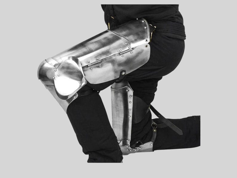 Close-up of adjustable leather straps on Medieval knight leg armor set
