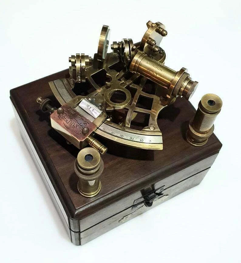 Antique brass nautical sextant measuring 5 inches, a collectible marine instrument