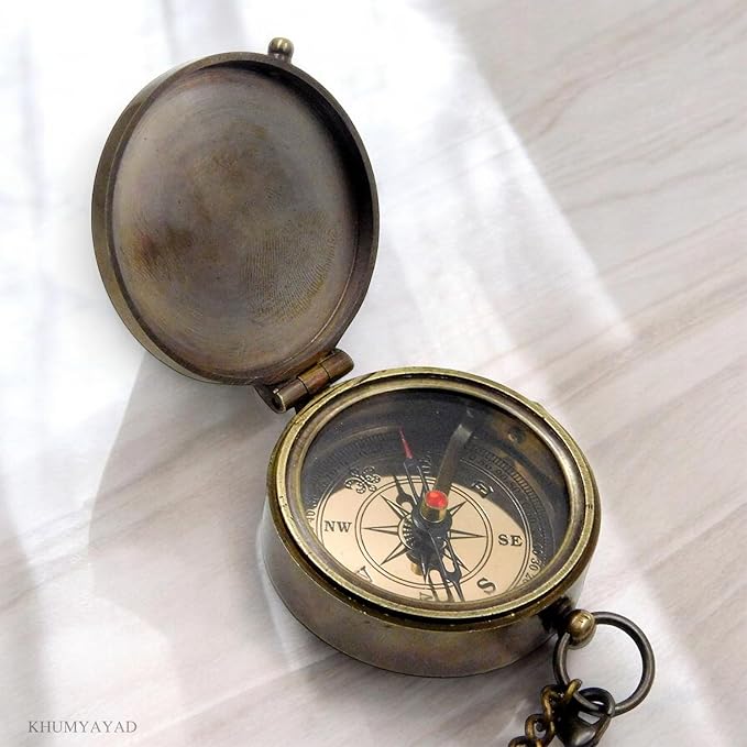 Antique brass compass with attached 30-inch brass chain.