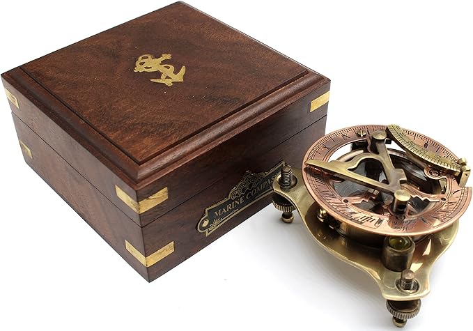 Close-up of solid brass antique maritime compass showing sundial markings