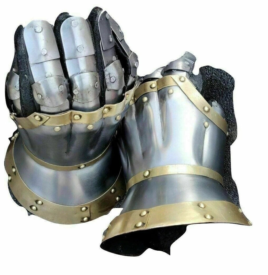 Close-up of red suede leather glove riveted to medieval steel gauntlet
