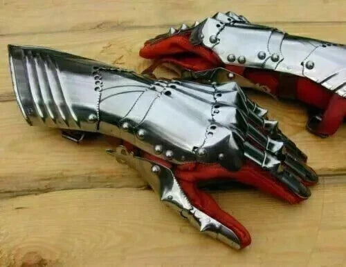 Close-up of Artisans Hub medieval steel gauntlets showing detailed metalwork and fastening straps