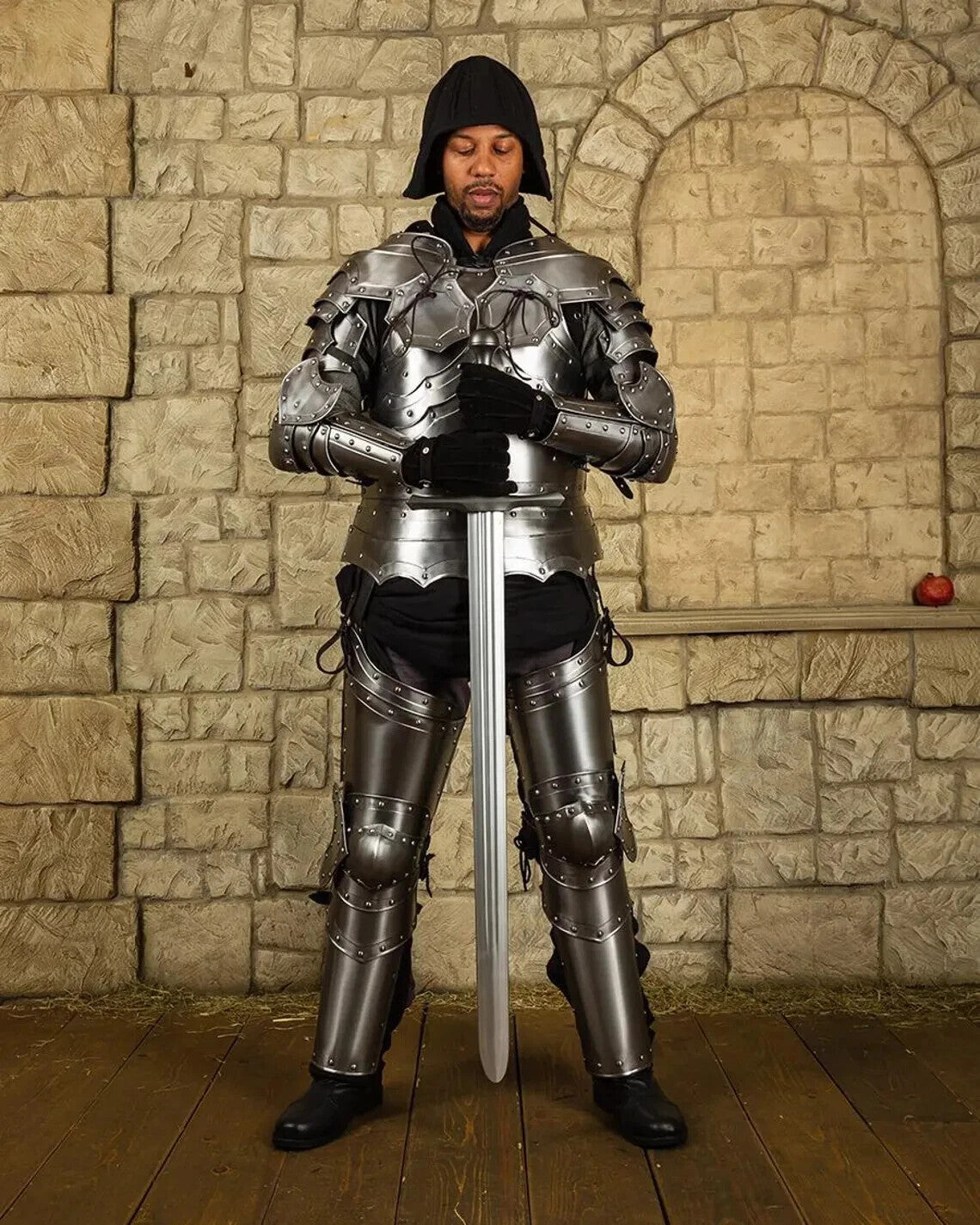 Front view of the Balthasar full body medieval knight armor suit in polished steel, handcrafted and fully wearable by Artisans Hub.