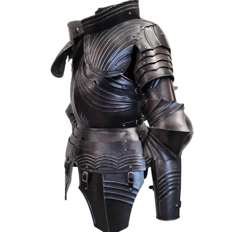Side view of the full leg armor with greaves and articulated knee plates, showcasing adjustable leather straps and gothic styling.