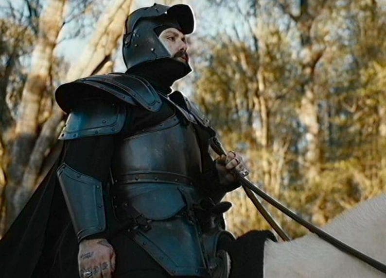 Black steel leg greaves from a full plate knight armor set, ideal for LARP and medieval cosplay.