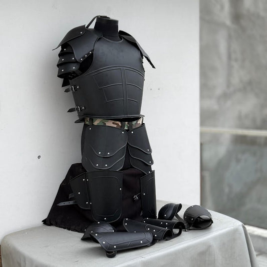 Close-up of black undead knight pauldrons and steel bracers from the armor suit