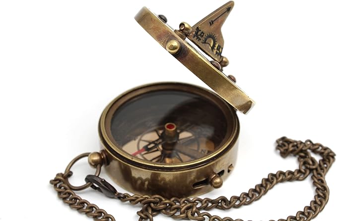Close-up side angle of the brass compass showing engraved details and sundial.