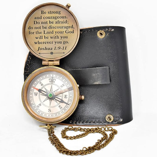 Faith compass featuring a cross engraving on the lid, paired with a leather carrying case.