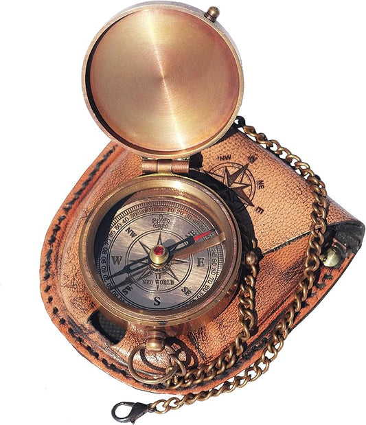 Handcrafted brass compass shown with leather case and brass chain.