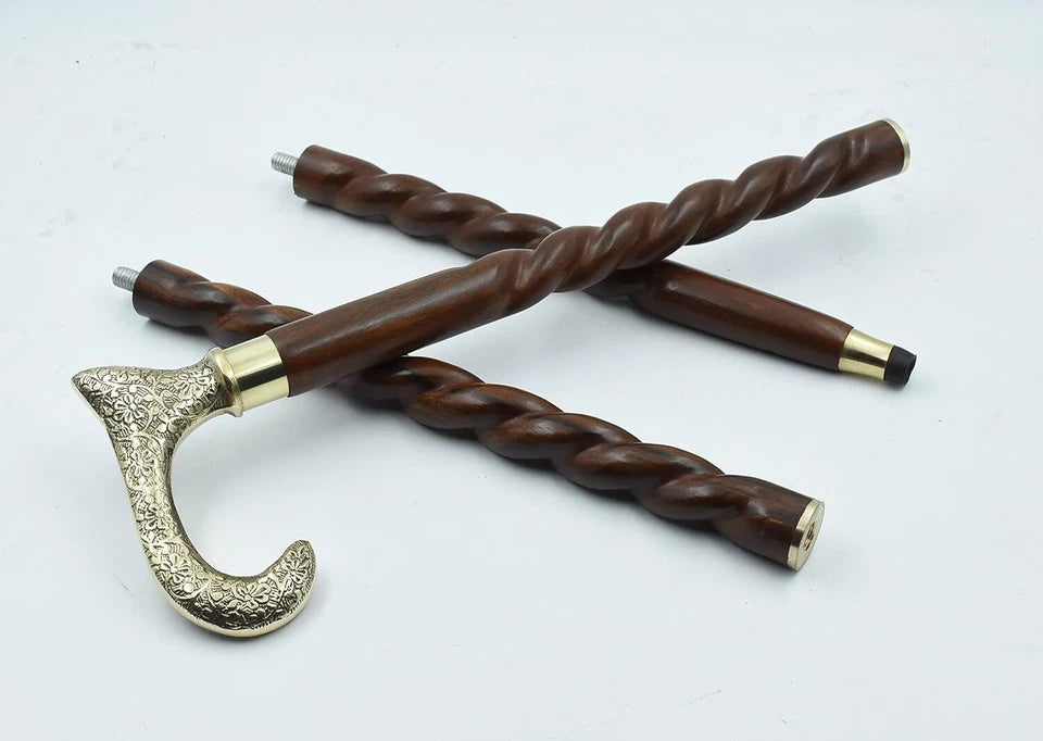 Close-up of brass derby engraved handle on wooden walking stick