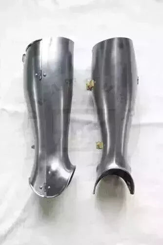 Close-up of brass-plated leg guards showing handmade detailing and craftsmanship