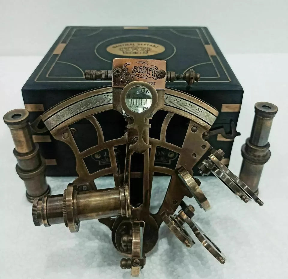 Brass nautical sextant instrument housed in an engraved wooden display case