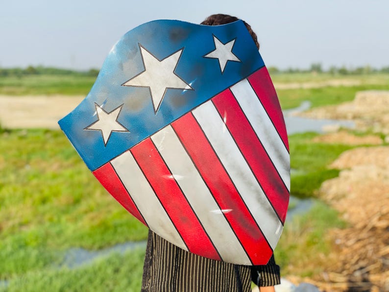 Side angle of the Captain America Heater Shield highlighting the leather straps and sturdy aluminium.