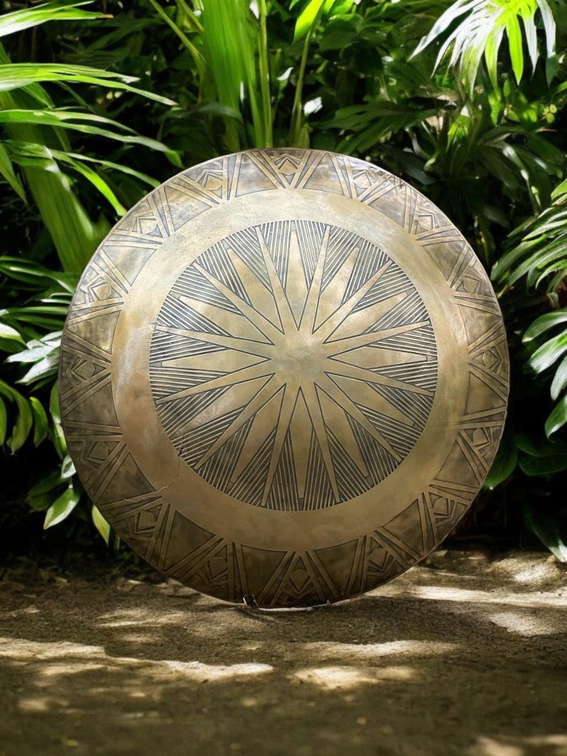 Captain America style round shield side angle with metallic finish