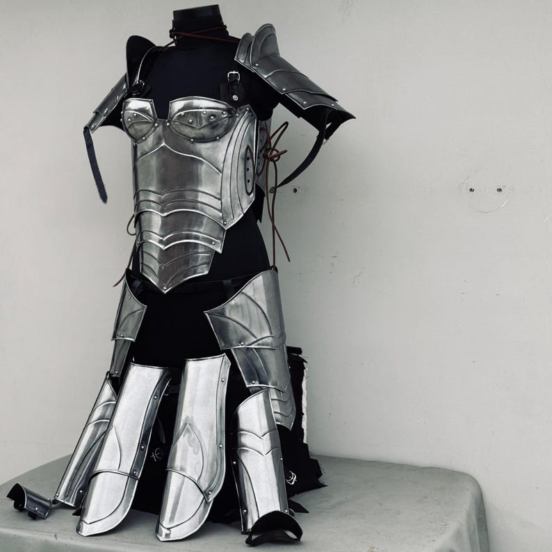 Close-up of cosplay armor details with leather straps and polished steel plates for LARP use