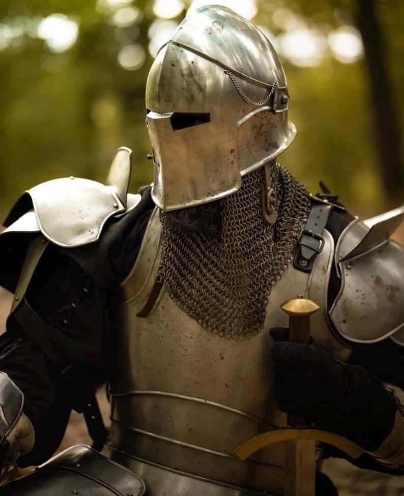 Side view of steel cuirass with attached tassets and lower leg greaves, highlighting thigh and shin protection in the knight armor set.