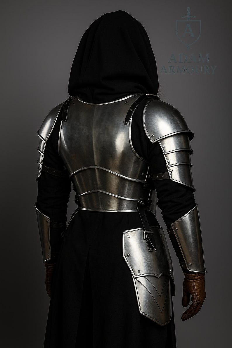 Close-up of female knight armor showing riveted pauldrons and steel bracers