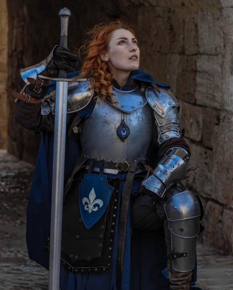 Side view of the full leg armor set including cuisses, poleyns, and greaves, custom-fitted for a female knight silhouette.