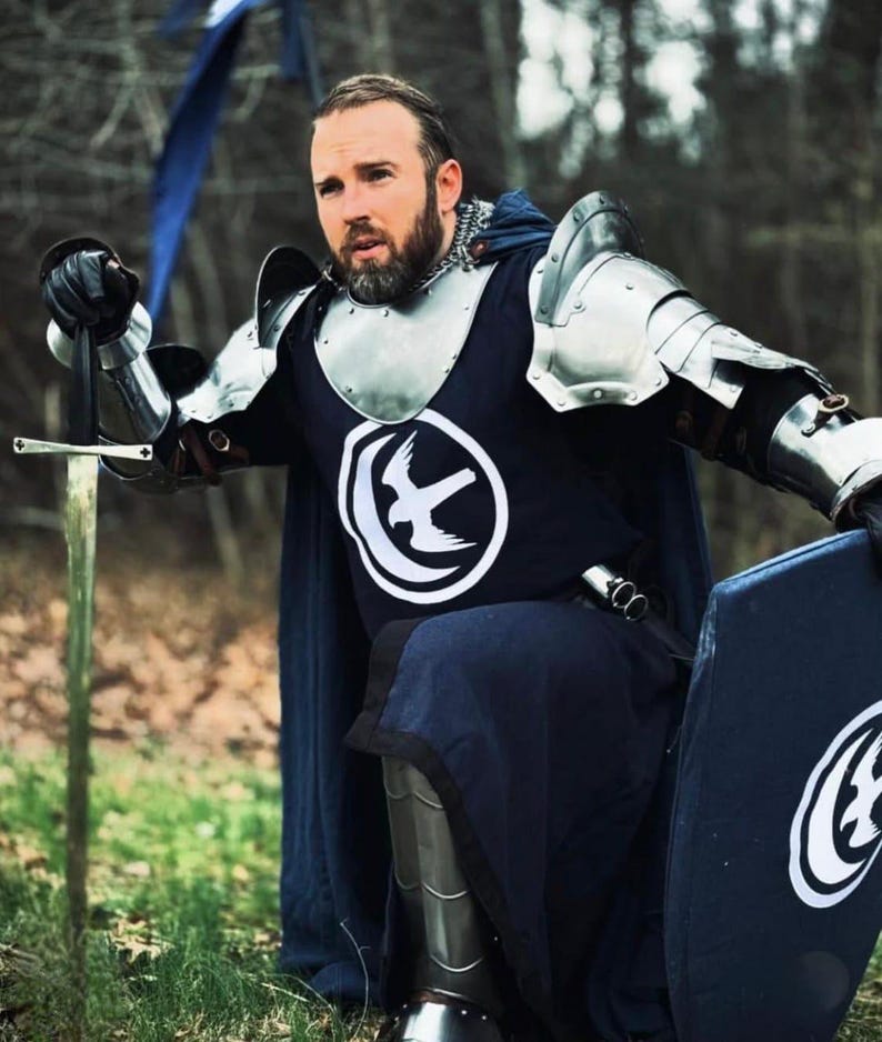 Detailed view of the cuirass and tassets with articulated lower plate protection, designed for full torso and thigh coverage.