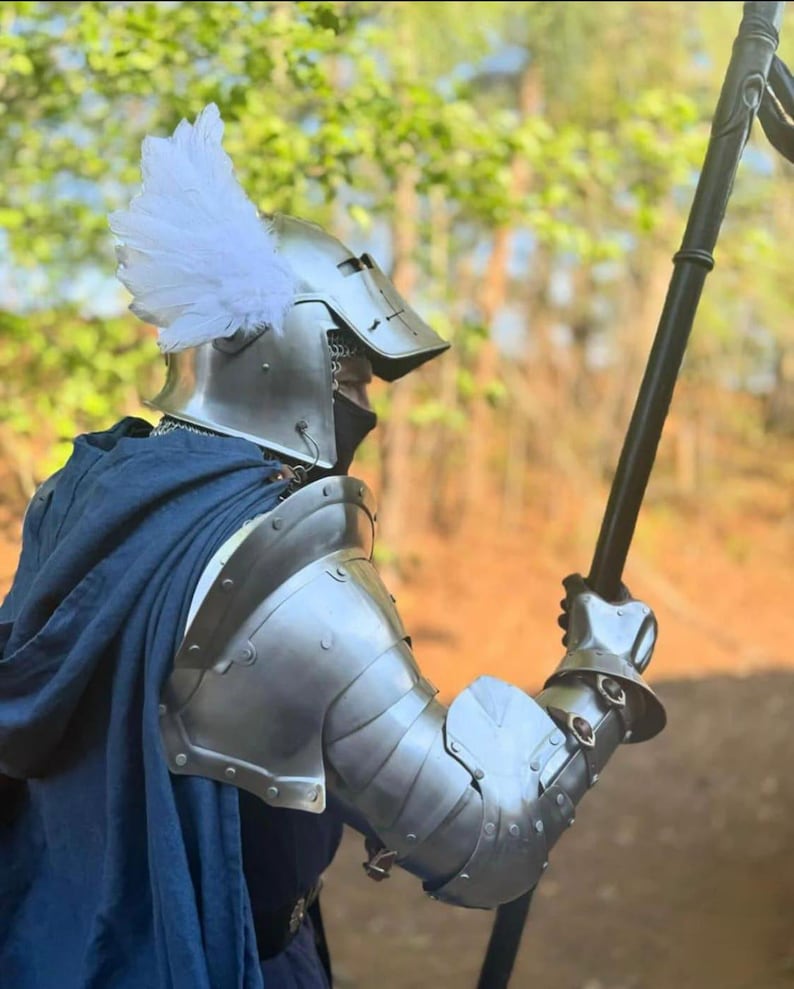 Close-up of the gauntlets and bracers from the Valiant Seraph armor set, showing hand articulation and forearm defense.