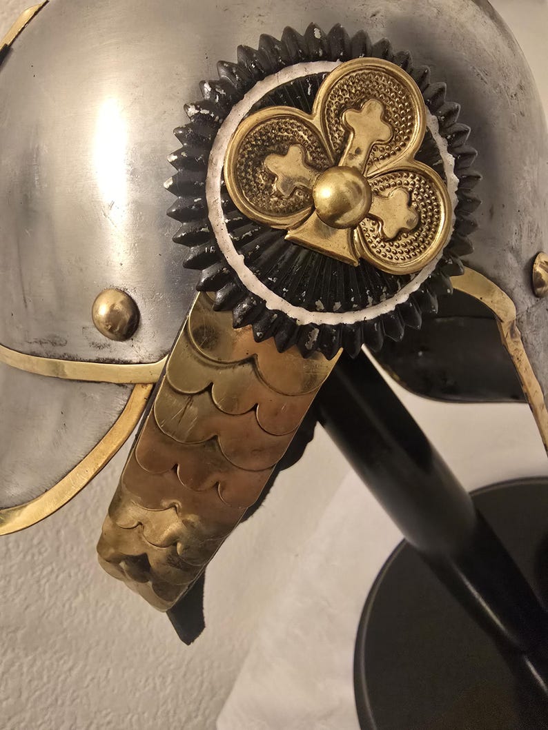 German Pickelhaube helmet displayed on free wooden stand for collectors