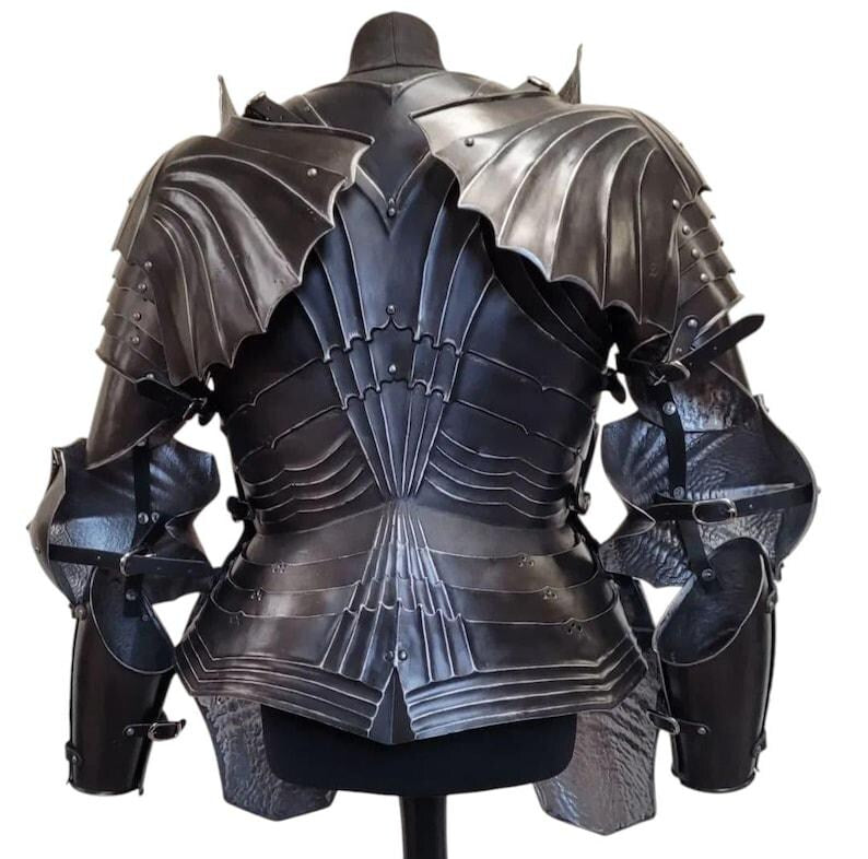 Close-up of black steel gauntlets and flexible chainmail coif included in the gothic armor set, highlighting craftsmanship and texture.