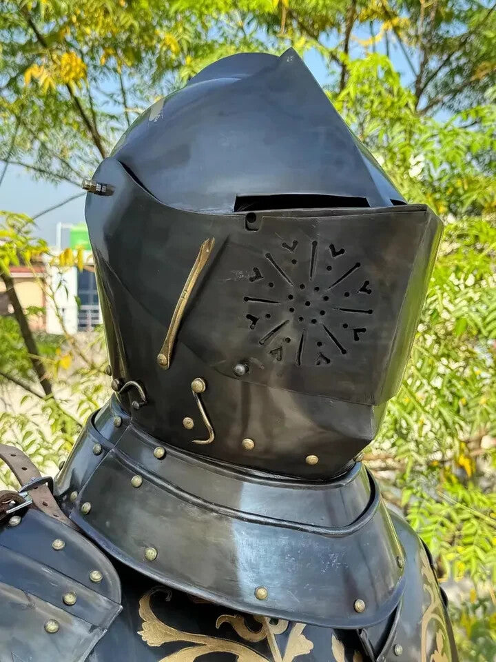 Close-up of Gothic-style steel helmet from the knight armor suit, featuring blackened steel finish and visor detail, ideal for cosplay and reenactments.