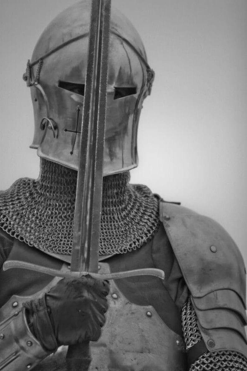 Gothic knight armor showing detailed leg greaves and bracers for full lower body defense.