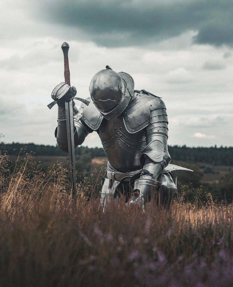 Complete medieval knight armor set with horned helmet and sword included.