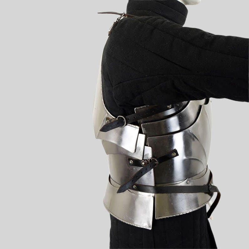 Side angle showing adjustable leather straps on steel Gothic breastplate armor for medieval reenactment.
