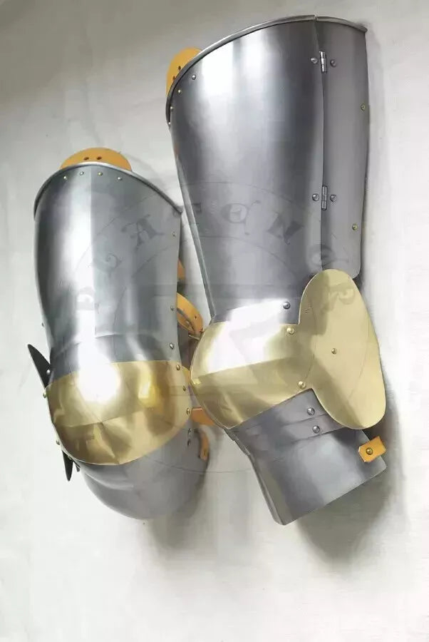Close-up of gothic warrior leg armor with silver steel finish and detailed craftsmanship