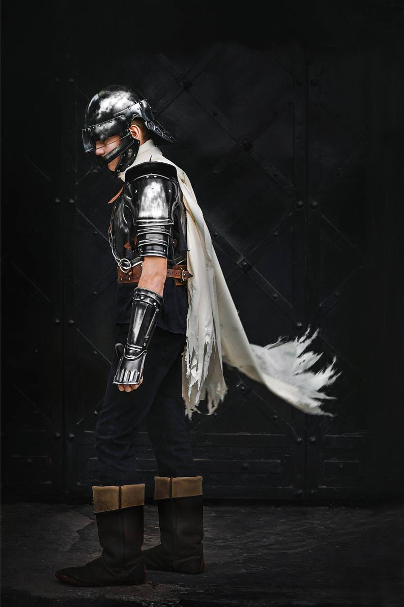 Side angle of Guts cosplay armor set with helmet, bracers, and shoulders