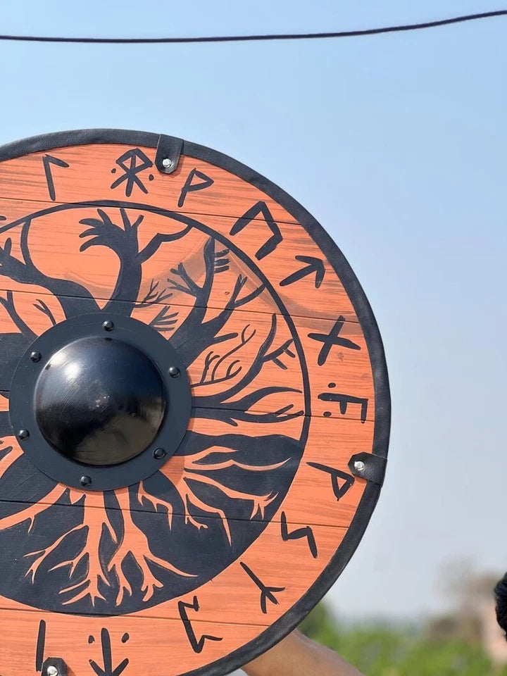 Side view of handcrafted Viking shield showing wood texture and build