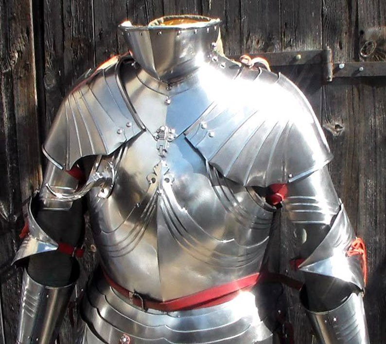 Close-up of Gothic armor fluting and adjustable leather straps on handmade half armor suit