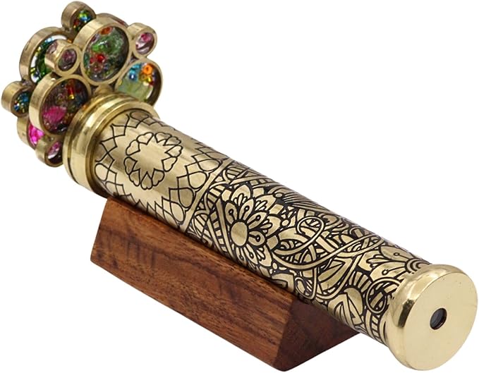 Elegant etched brass kaleidoscope displayed on a polished hardwood base