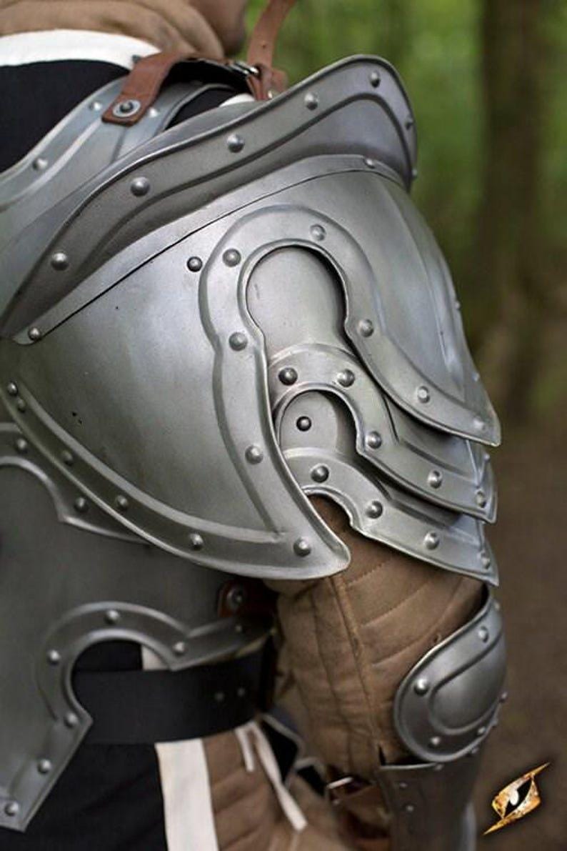 Side angle showing the bracers and greaves of the knight armor set, emphasizing arm and leg protection.