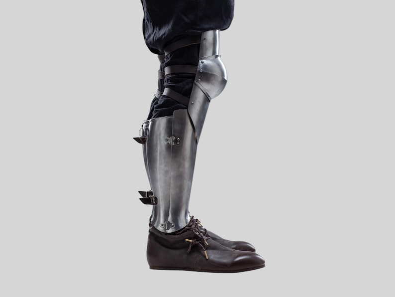 Knight armor leg greaves with knee guards and black leather fixing straps