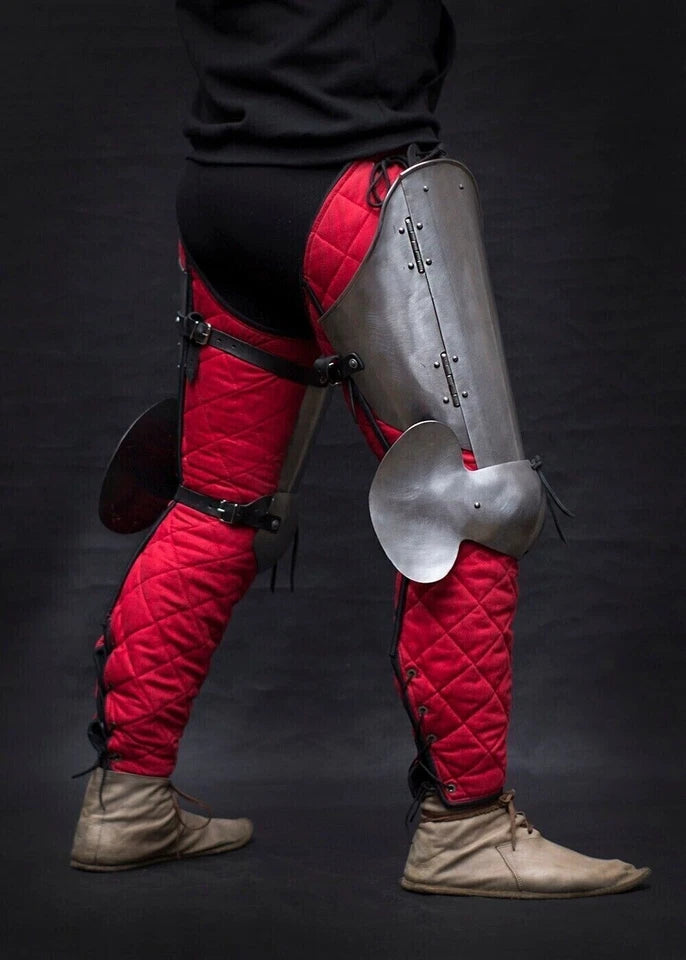 Close-up of knight leg armor cuisses with silver nickel polish finish