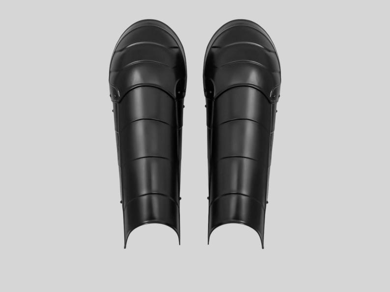 LARP and cosplay-ready blackened mild steel leg greaves with buckled fitting