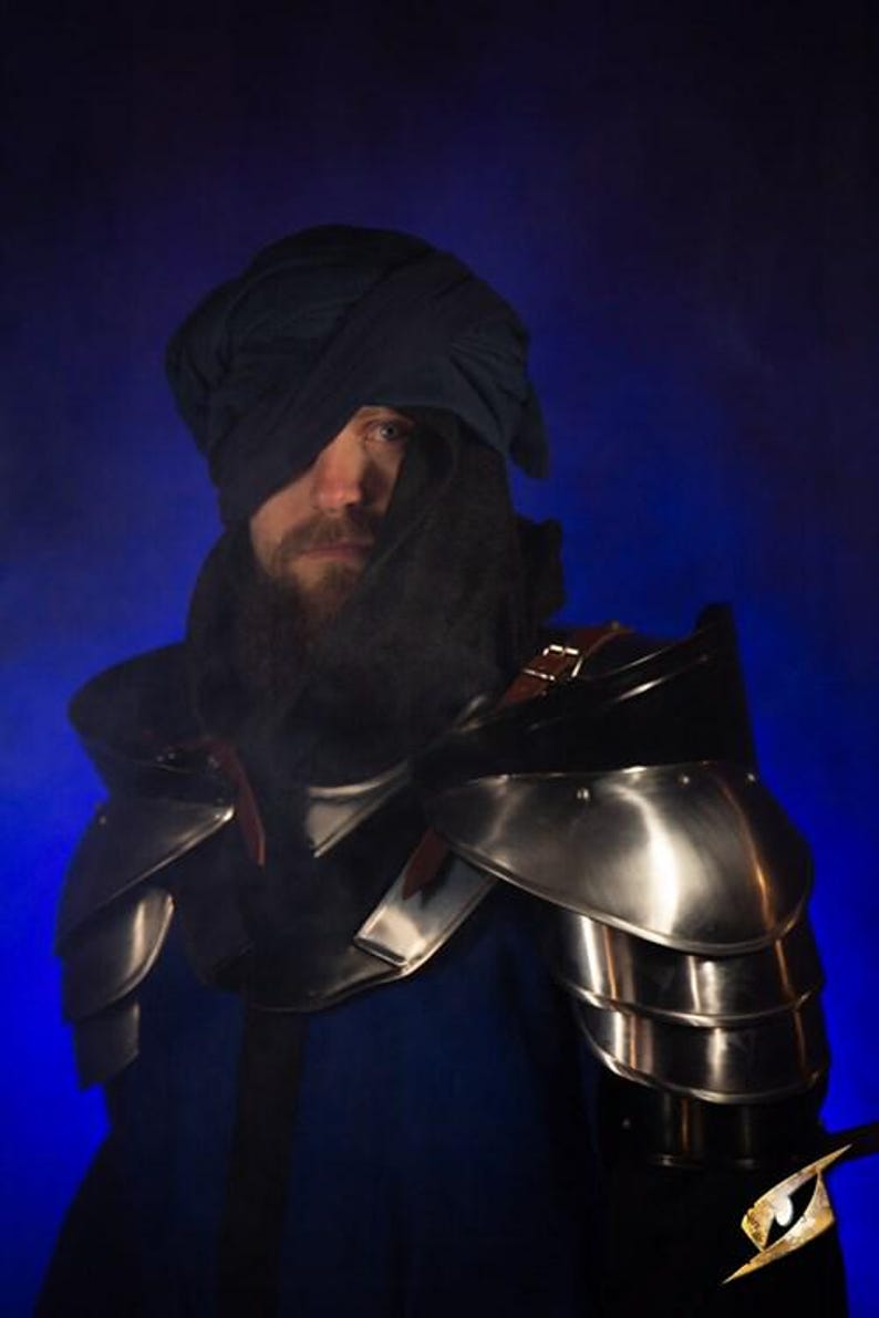 Close-up of LARP shoulder armor set showing leather straps and steel finish