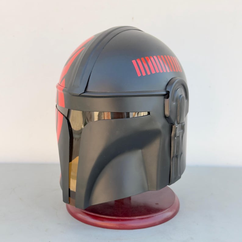 Weathered steel Mandalorian helmet replica featuring battle-worn finish and T-visor