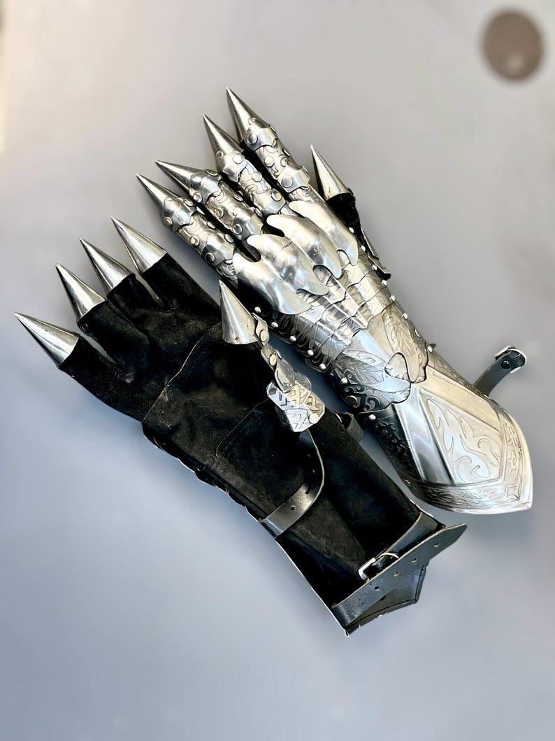 Medieval etched steel gauntlets with adjustable leather straps for secure LARP wear