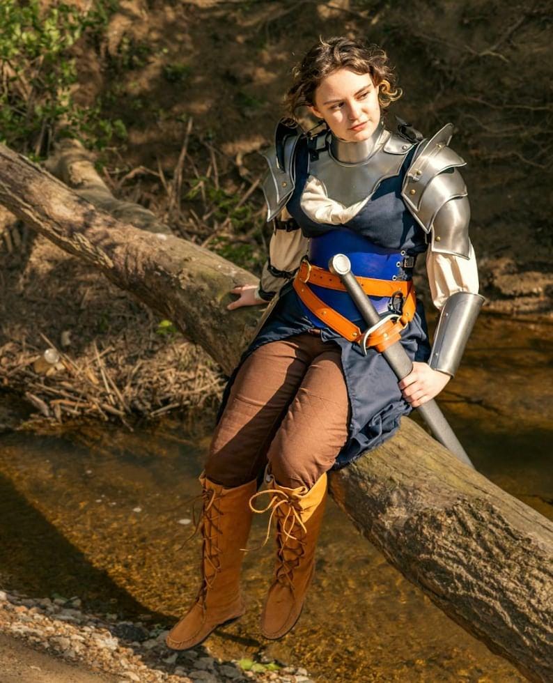 Complete Lady of Steel knight armor displayed in a medieval-inspired setting, perfect for cosplay, LARP, or Renaissance fairs.