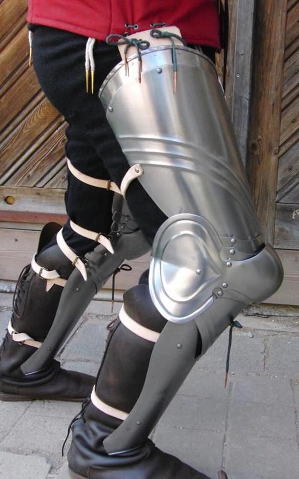 Side view of handcrafted medieval steel leg armor for cosplay and reenactment