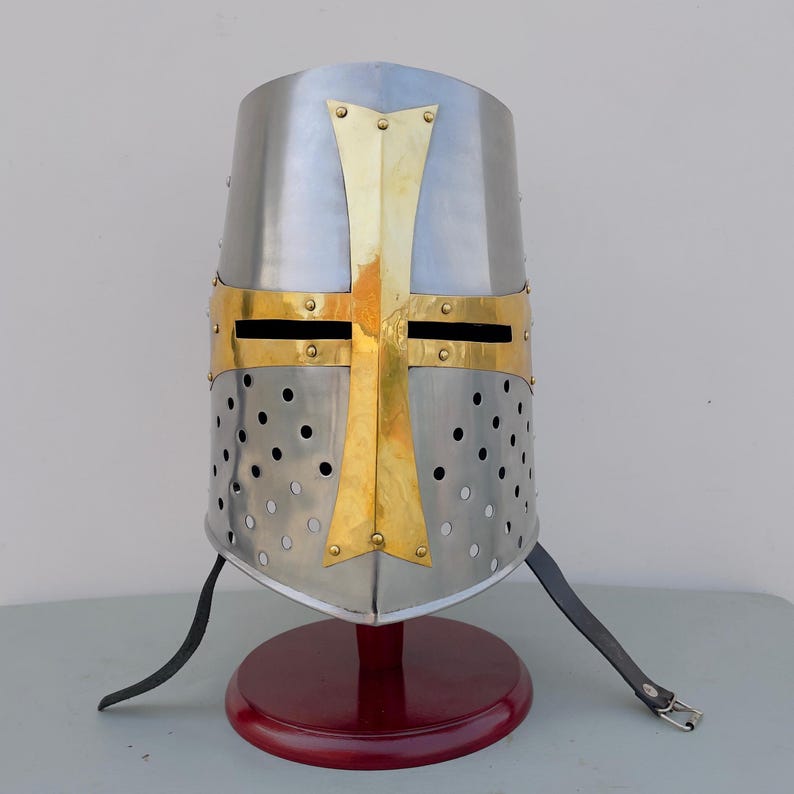 Medieval knight helmet featuring iconic red Templar cross design