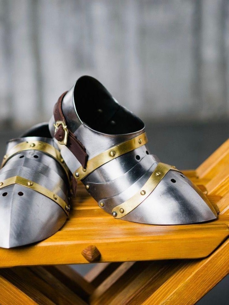 Side view of medieval knight steel brass sabatons with detailed finish for LARP and cosplay