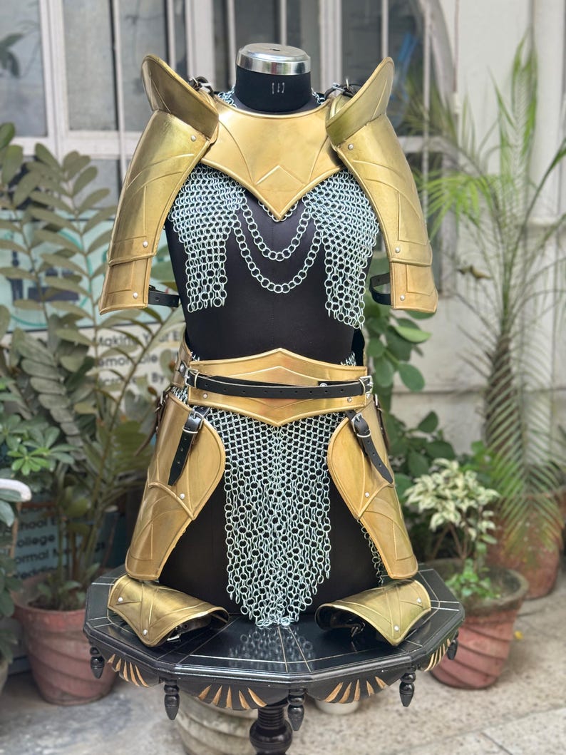 Back detail of Medieval Lady Warrior armor with antique gold finish and chainmail skirt