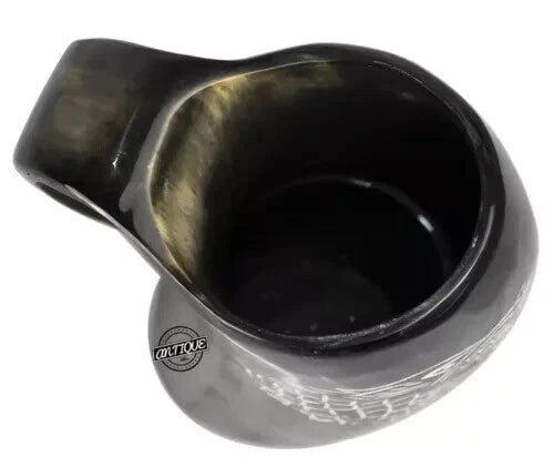 Side view of handcrafted ox horn beer mug with natural textures and polished finish.