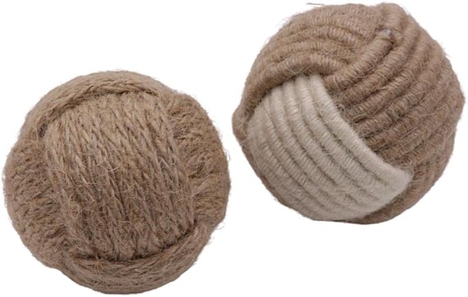 Jute and cotton rope balls placed in a rustic tray on a modern coffee table