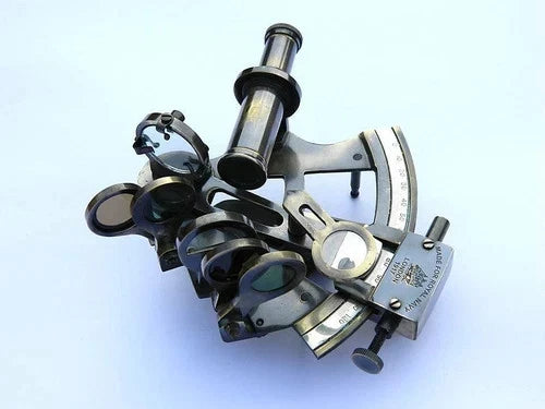 Nautical brass sextant navigation instrument featuring glass optics and antique detailing